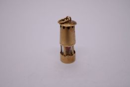 9ct yellow gold charm in the form of a miners lamp, Birmingham 375, sponsor WHC, 20mm, 2.2g approx