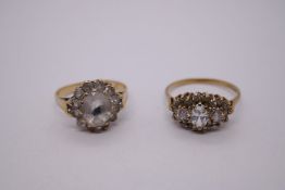 Two 9ct yellow gold clear stone set cluster rings, both marked 375, sizes Q + L, 5.3g approx