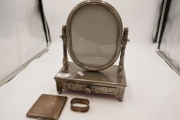 A silver plate dressing table mirror marked Vera Lucino, with ornate decoration and a draw. Also wit