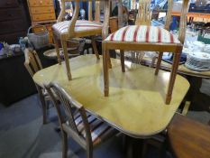 A D-End dining table and a set of 6 chairs incl. 2 carvers