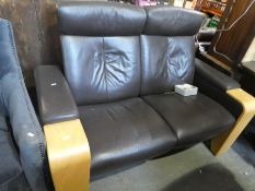 An Ekornes Stressless reclining 2 seat setee in brown leather with arm compartments and matching tri