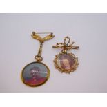 Two gilt metal brooches suspended with circular fob lockets