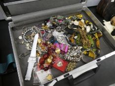 Vintage briefcase containing modern costume jewellery