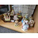 Twelve Beswick Beatrix Potter figures and a Beswick tree stump stand. (figures all boxed)