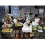 Twelve Royal Albert Beatrix Potter figures and a Beswick tree stamp stand (mainly boxed)