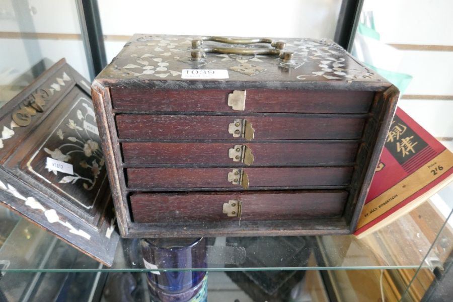 An old mahjong set in mother of pearl decorated case