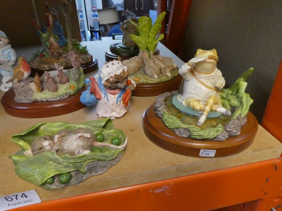 A quantity of Beswick Studio sculptures of Beatrix Potter figures and sundry