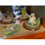 A quantity of Beswick Studio sculptures of Beatrix Potter figures and sundry