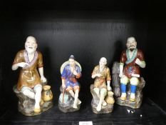 Two pairs of 20th century oriental figures
