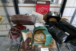 A Movikon camera, a barometer, a selection of other cameras and sundry