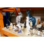 A large selection of ceramic cats, including Beswick, etc