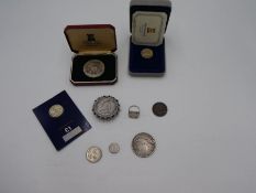 George III Silver Crown, 1887 Victoria silver double florin in white metal brooch mount, and a selec