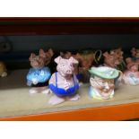 A quantity of NatWest pigs and three character jugs