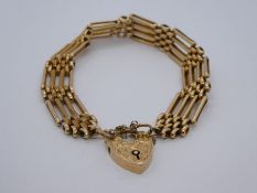 Antique 15ct yellow gold 4 bar gate link bracelet with floral engraved padlock clap and safety chain