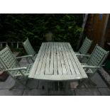 Teak stained teak table and four folding chairs with square lattice design