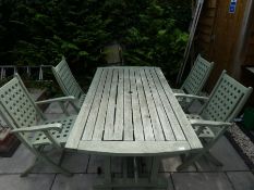 Teak stained teak table and four folding chairs with square lattice design