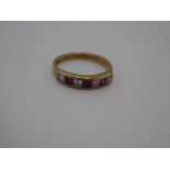 9ct yellow gold half eternity chanel set ruby and clear stone ring, size R, 2.7g, marked 375