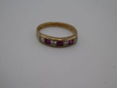 9ct yellow gold half eternity chanel set ruby and clear stone ring, size R, 2.7g, marked 375