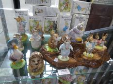 Twelve various Beswick Beatrix potter figures and a Beswick tree stump carved (mainly boxed)