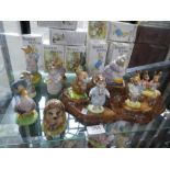 Twelve various Beswick Beatrix potter figures and a Beswick tree stump carved (mainly boxed)