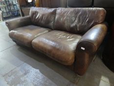 A modern brown leather settee