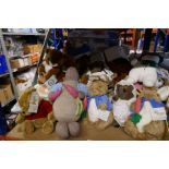 A shelf full of mostly soft toys of Peter Rabbit, Winnie The Pooh and Friends, Jigsaw Puzzles etc