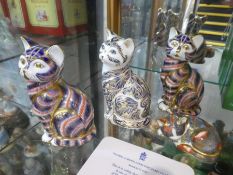 Four Royal Crown Derby paperweights including limited edition Majestic cat 1554/3500 with certificat