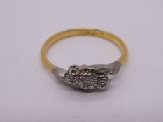 Antique 18ct cross over design ring with three illusion set diamonds in platinum mount, marked 18ct