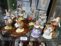 Nine Royal Albert Beatrix Potter figures, a Beswick tree stump stand and three Beswick figures (main