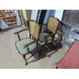 A pair of mahogany open armchairs having cane backs and a gilt framed mirror