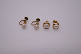 Two pairs of 14K yellow gold pearl earrings, one a stud pair and the other a screw on example