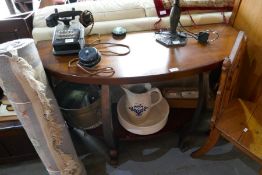 A reproduction two tier hall table having bow front