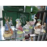 Nine exclusive gold back stamp Beswick Beatrix potter figures (mostly boxed)