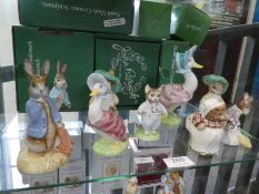 Nine exclusive gold back stamp Beswick Beatrix potter figures (mostly boxed)