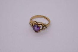 14ct yellow gold ring with heart shaped amethyst mounted in heart shaped frame on diamond chip set