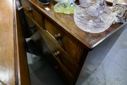 An antique mahogany Pembroke table, a chest of drawers and a pine dressing table