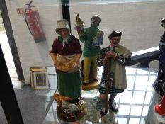 Three Royal Doulton figures to include; Punch and Judy Man HN2765, The Farmer's Wife and The Laird.