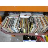Three large crates of mixed 45s mostly from the 70s and 80s