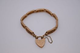 9ct yellow gold decorative gatelink bracelet with heart shaped clasp and safety chain, clasp not att