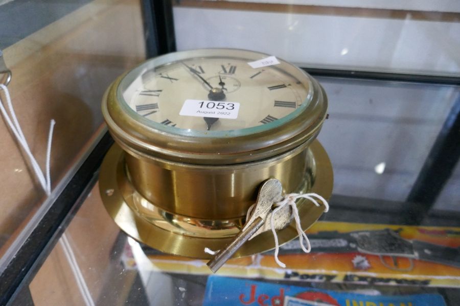 A brass bulkhead ships clock by Elliot