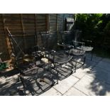 A set of 4 black painted metal garden chairs