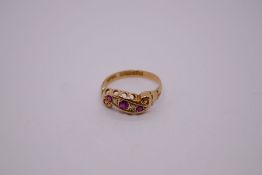 18ct yellow gold pretty ring, with scrolling panel set with rubies and diamonds, marked 18, Birmingh