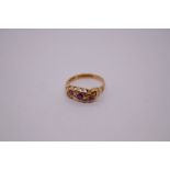 18ct yellow gold pretty ring, with scrolling panel set with rubies and diamonds, marked 18, Birmingh