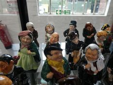 Royal Doulton Dickens figures; a set of 25 examples