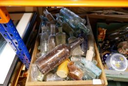 A vintage branded wooded crate of dump find vintage bottles