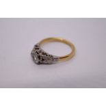 Antique 18ct yellow gold illusion set diamond ring mounted in platinum with floral split shoulders,