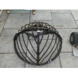 Two cast iron hay wracks