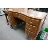 A mid 20th century Indian carved dressing table having shaped front with seven drawers, 106cms