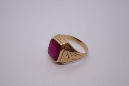 10K yellow gold gents signet ring set in set with large scissor cut ruby, marked 10K, size Z + 1