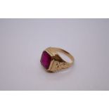 10K yellow gold gents signet ring set in set with large scissor cut ruby, marked 10K, size Z + 1